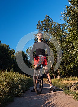 Mountain bike cyclist riding at sunrise healthy lifestyle doing