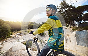 Mountain bike, forest and sports man in gear for outdoor travel, journey or performance training with challenge, focus