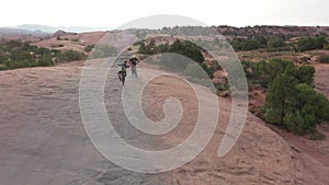 Mountain bike, hill and friends in race, fitness challenge and extreme sports with balance and journey in South Africa