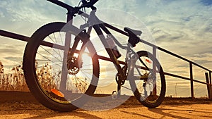 Mountain bike parked against rails