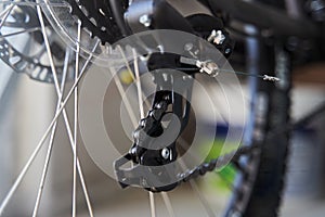 Mountain bike rear derailleur close-up. Rear racing bike cassette on the wheel with chain