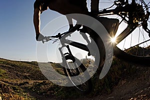 Mountain bike rider in sunset