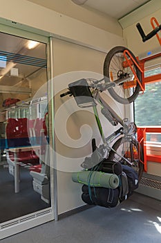 Mountain bike with saddlebags is transported in the train.