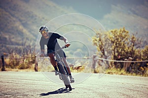 Mountain bike street, cycling exercise and man training for professional competition, happy with sports on bicycle and