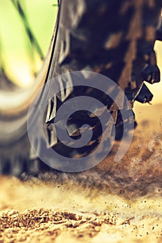 Mountain bike wheel close up with dirt dust particles