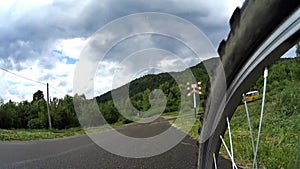 Mountain biker crossing railroad tracks in Bieszczady, Poland