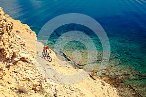 Mountain biker cycling at the seaside bike trail