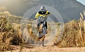 Mountain biker, dirt bike and dessert rider cycling on sports bicycle on nature path, dirt road and extreme sport