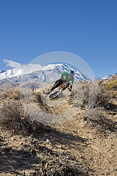 Mountain Biker Leans Into Turn