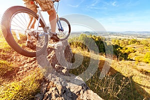 Mountain biker looking at downhill dirt track