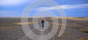 Mountain biker on old desert road