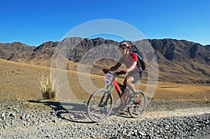 Mountain biker racing in desert