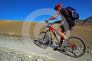 Mountain biker racing in desert