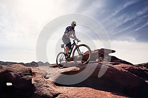 Mountain biker rides at the desert scenic in Kazakhstan