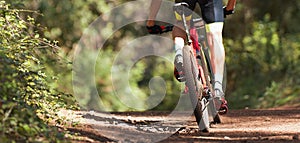 Mountain biker riding on bike singletrack trail