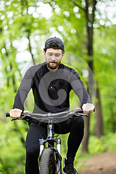 Mountain biker riding on bike in spring inspirational mountains landscape. Sport fitness motivation and inspiration. Rider