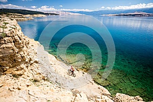 Mountain biker riding on bike in summer seaside