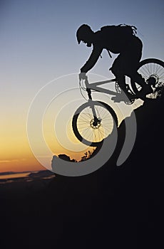 Mountain Biker Riding Down Slope