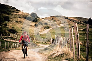 Mountain biker riding MTB bicycle photo