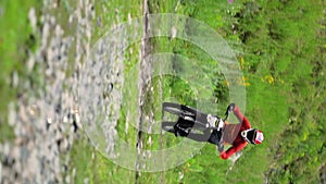Mountain biker riding on trail in green forest