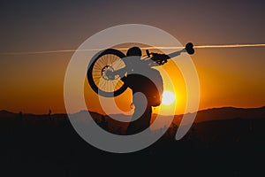 Mountain biker silhouette in sunset