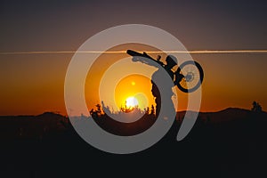 Mountain biker silhouette in sunset