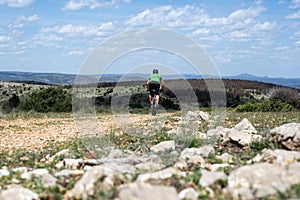 Mountain biker on trail high in the mountains of Spain