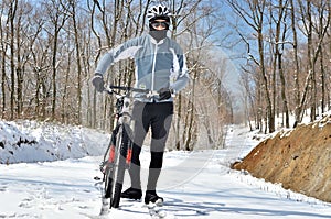 Mountain biker in winter snow