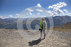 Mountain Bikers Going Down A Steep Road