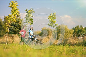 Mountain Bikers Having a Stroll in Summer Forest