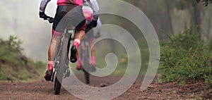 Mountain bikers riding on bike singletrack trail