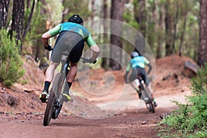 Mountain bikers riding on bike singletrack trail