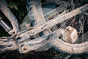 Mountain biking, dirty and broken bicycle closeup