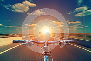 Mountain biking down hill descending fast on bicycle. View from