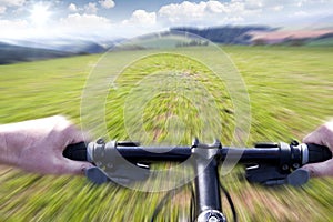 Mountain biking down the trail