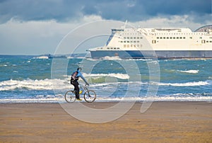 mountain biking on the Opal Coast with the English Channel and a ferry in the background