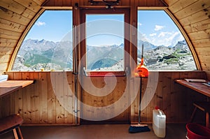Mountain bivouac free sleeping shelter in the piedmontese alps Italy, facing the Mount Viso photo