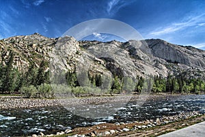 Mountain and Black River with Blue Sky