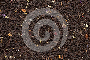 Mountain black tea leaves with flowers and fruits texture