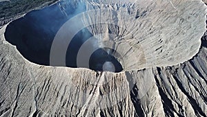 Mountain Bromo active volcano crater in East Jawa, Indonesia. Top view from drone fly. 4K footage