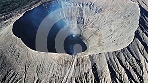 Mountain Bromo active volcano crater in East Jawa, Indonesia. Top view from drone fly. 4K footage