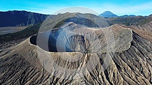 Mountain Bromo active volcano crater in East Jawa, Indonesia. Top view from drone fly. 4K footage