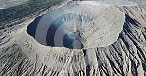 Mountain Bromo active volcano crater in East Jawa, Indonesia. Top view from drone fly. 4K footage