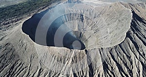 Mountain Bromo active volcano crater in East Jawa, Indonesia. Top view from drone fly. 4K footage