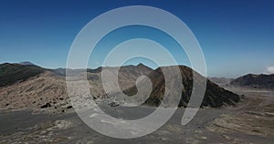 Mountain Bromo active volcano crater in East Jawa, Indonesia. Top view from drone fly. 4K footage