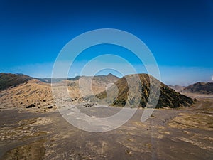 Mountain Bromo active volcano crater in East Jawa, Indonesia. Top view from drone fly