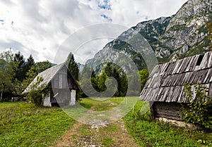 Mountain cabins in the region of Ukanc near the Lake Bohinj in the Triglav National Park in Slovenia on summer day with clouds