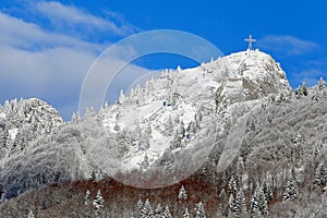 Mountain called Spitz with snow and the summit cross Above in Italy