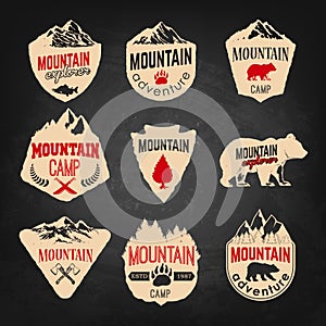 Mountain camp badges templates with mountains and trees isolated