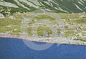 Mountain camping with tents near Bucura Glacier lake